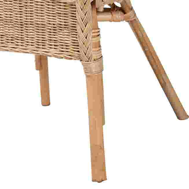 Close-up of natural rattan dining chair leg and arm support