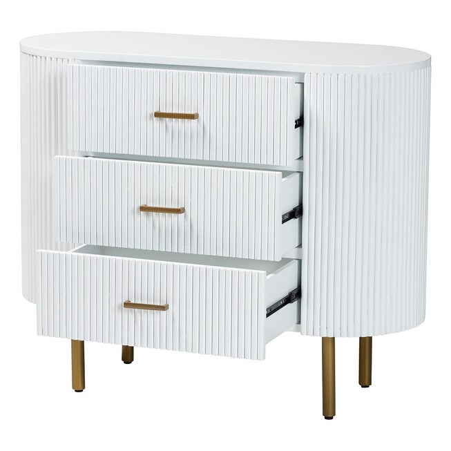 White fluted dresser showing three open drawers with gold bar pulls