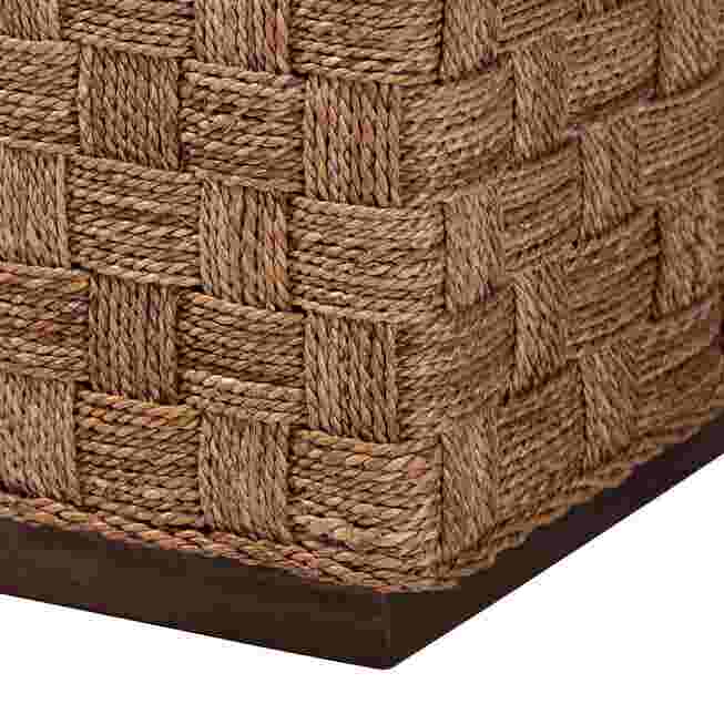 Corner of seagrass end table with dark base