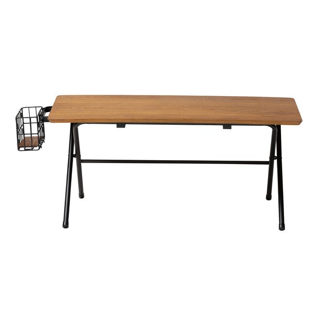 Coffee table with natural wood top, black metal legs, and wire basket