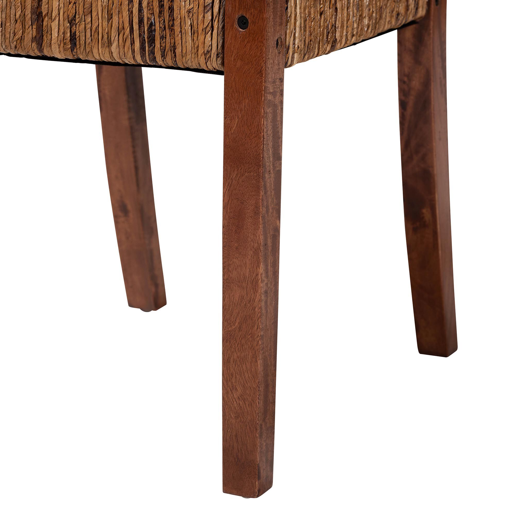 Close-up of mango wood chair legs under woven backrest