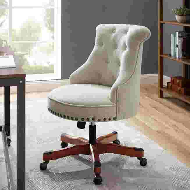 White tufted office chair in room setting