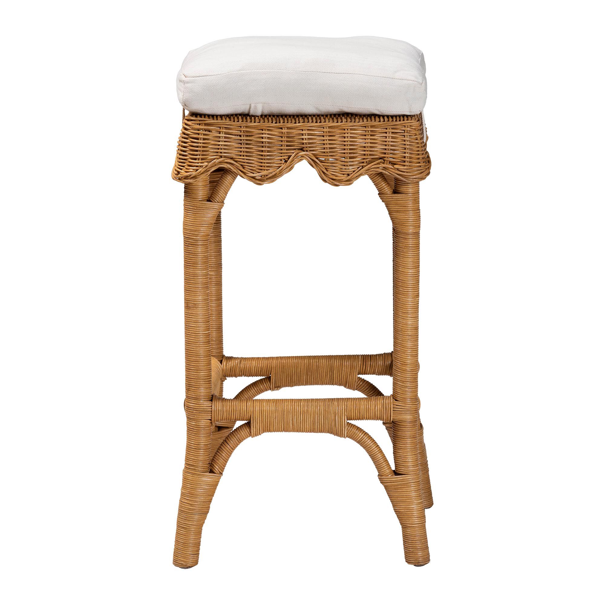 Honey rattan bar stool side view with white upholstered cushion