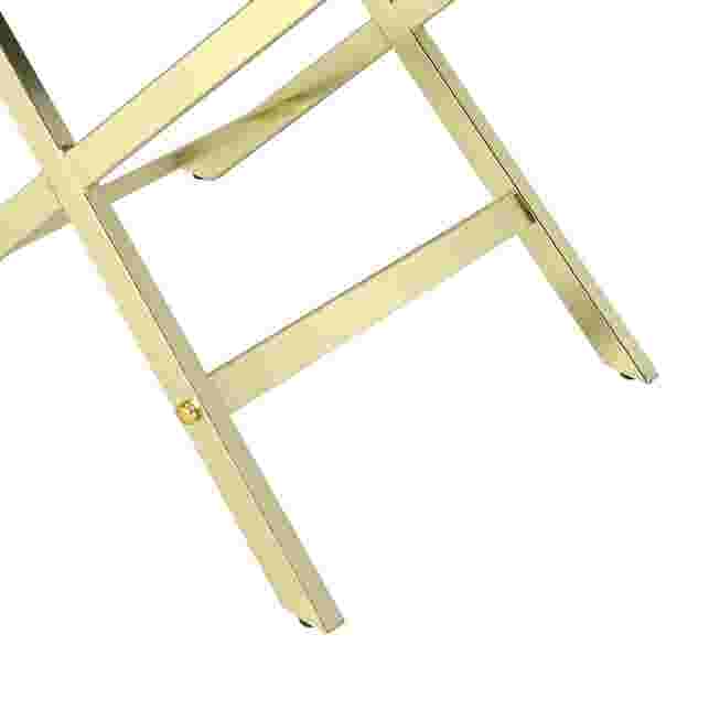 Gold X-frame legs close-up
