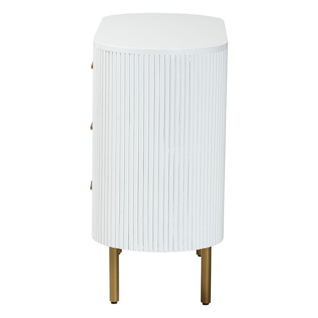Side view of white fluted 3-drawer dresser with gold tapered legs