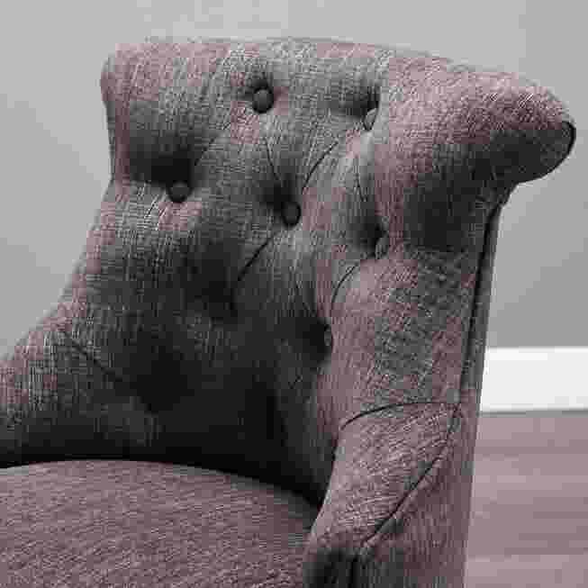 Close-up of tufted back of chair