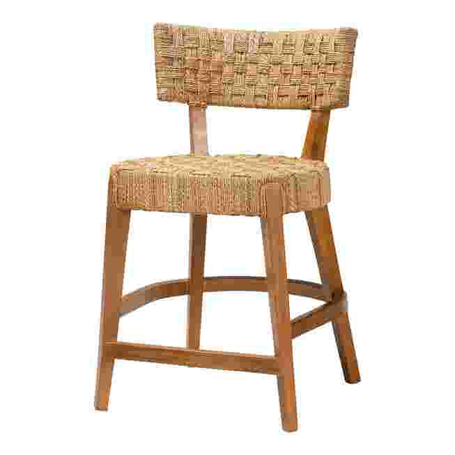 Close-up of wooden counter stool with woven seat and back