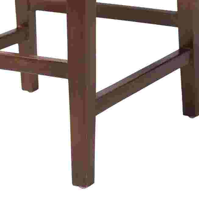 Close-up of dark wooden legs and footrest on seagrass bar stool