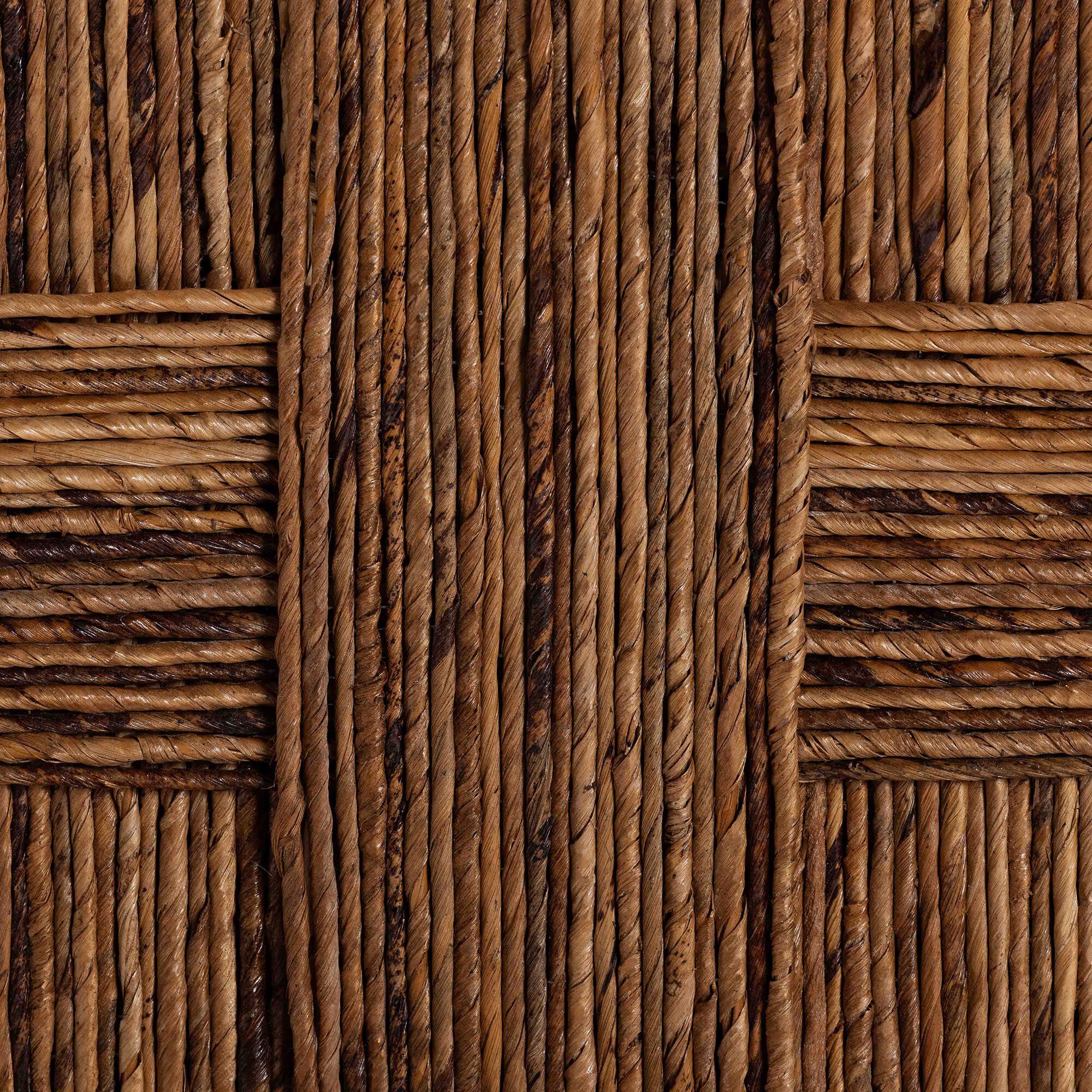 Close-up of woven seagrass pattern on chair backrest