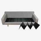 Sofa with pull-out black mat cushions arranged in a row, showing a convertible seating arrangement.